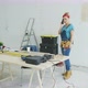 Cheerful Female Carpenter Talking on Smartphone - VideoHive Item for Sale