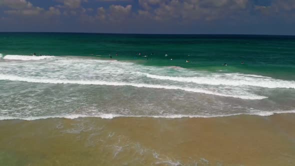 Surfers Surfing in Haifa Israel