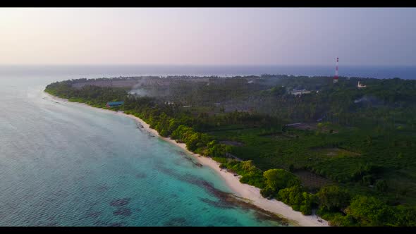 Aerial top view nature of luxury island beach wildlife by blue green water and white sand background