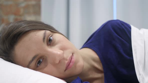 Hispanic Woman Getting Bored, Lying  in Bed