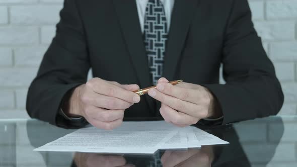 Businessman offers to sign an agreement.