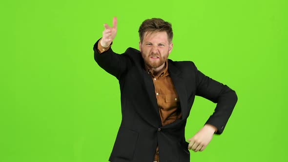 Guy in the Suit Got Angry and Started Shouting Loudly. Green Screen. Slow Motion