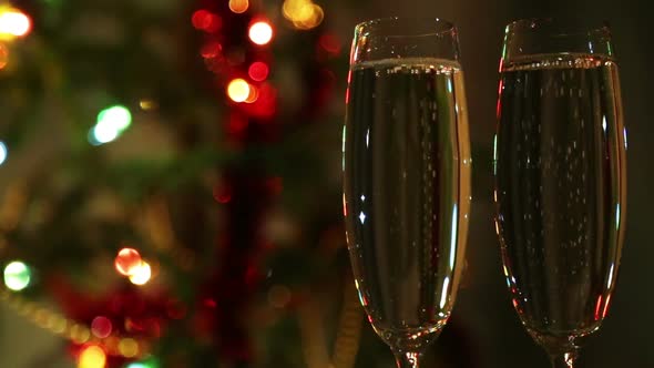 Glasses  Champagne Against Festive Lights Background