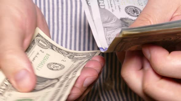 Man's Hands Counting Money