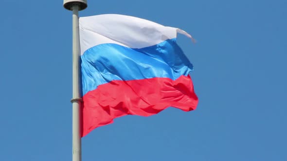 Russian Flag On Blue Sky Background