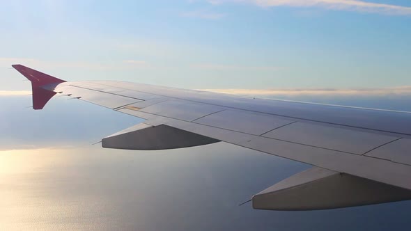 Looking On Wing And Sea From Airplane