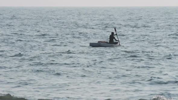 Lone Fisherman Floating In Sea On Fishing - Kerala India