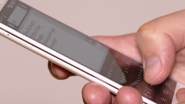 Man's Hands Printing Text On Smartphone 3