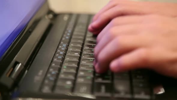 Man's Hands Printing Text On Laptop Keyboard 1