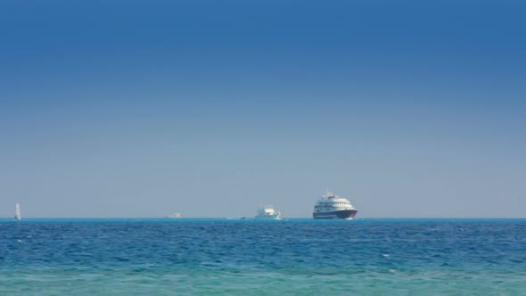 Yachts And Surfers On Turquoise Sea 1