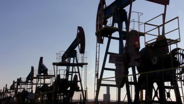 Many Working Oil Pumps Silhouette alt