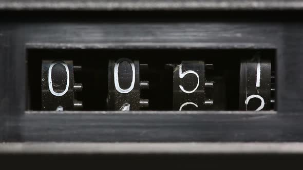 Old Mechanical Counter Quickly Counts Numbers - Macro alt