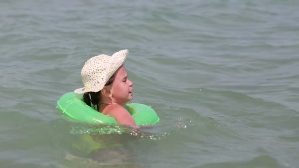 Cute Little Girl In Hat Bathing In Sea 1 alt