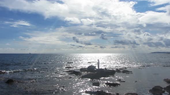 Fisherman  Spinning Near Sea In Sunlight