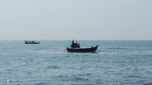 Fishermen In Boats Pulling Fishing Nets - Kerala India 1