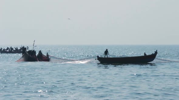 Fishermen In Boats Pulling Fishing Nets - Kerala India 2