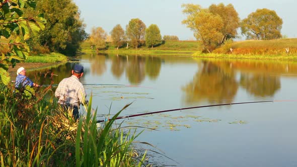 Fishing Senior Couple On Autumn Lake