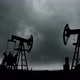 Working Oil Pumps Silhouette Against The Background Of The Darkest Storm Clouds - VideoHive Item for Sale