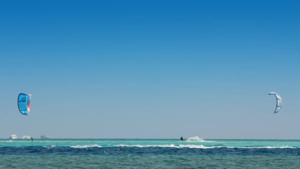 Kite Surfing - Surfers On Blue Sea Surface 4