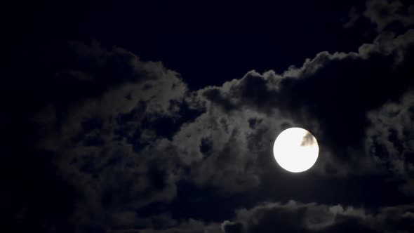 Moon Moving Between Clouds 3 alt