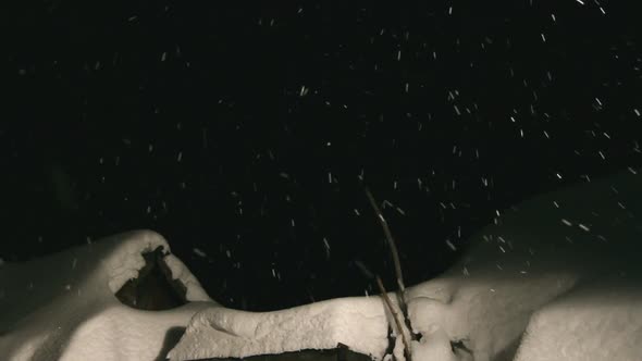 Night Snowfall And Snow-Covered Roof alt