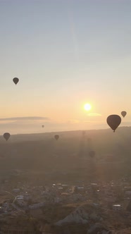 Vertical Video of Hot Air Balloons Flying in the Sky Over Cappadocia Turkey