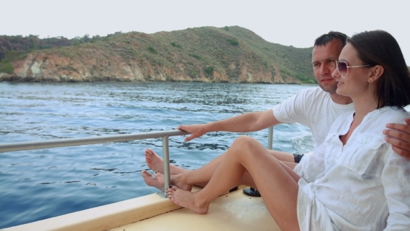 Romantic Happy Couple In Love Relaxing On a Yacht