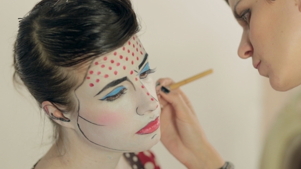 Visagist Applies The Red Dots On The Model's Face