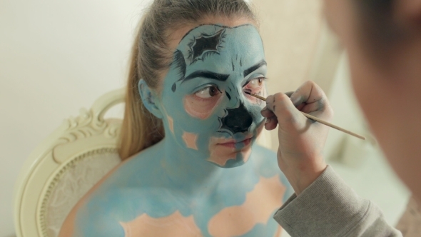 Visagist Applies Makeup Of Zombie To Girl