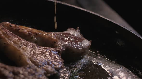 Onions are Thrown to the Сastiron Pan Fried in Butter