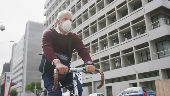 Caucasian man out and about in the street wearing on a face mask against coronavirus