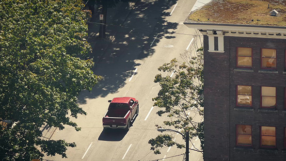 Vehicles Passing Next To Apartment From Above