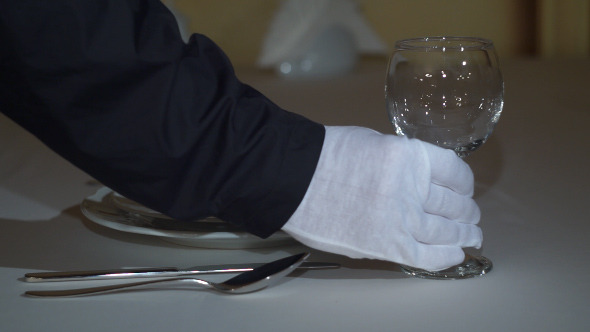 Waiter Setting Formal Dinner Table 03