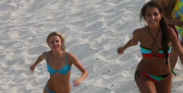 Young People Running On Beach