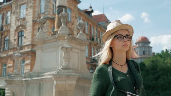 tourist woman Walking narrow streets of lviv, Ukraine. enjoying European summer holiday travel vacat