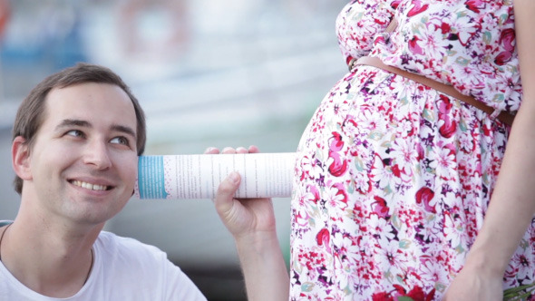 Husband And His Pregnant Wife On Walk