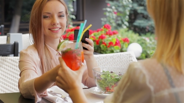 Girlfriends Drinking Cocktails And Talking