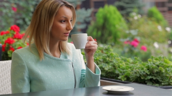 Drinking Coffee In Cafe alt