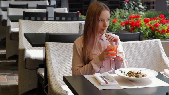 Woman With Cocktail At The Terrace Of Cafe