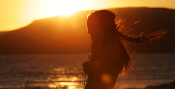 Girl Playing In The Sunset 2