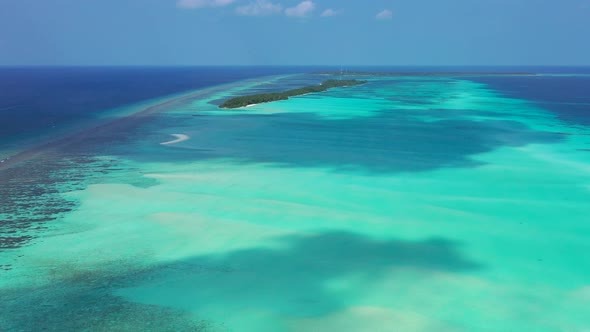 Natural fly over copy space shot of a paradise sunny white sand beach and blue ocean background in b