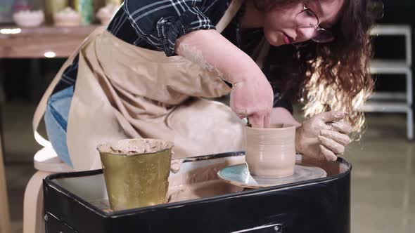 Pottery Crafting  Woman Forming a Pot From the Inside