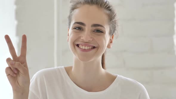 Victory Sign By Young Woman