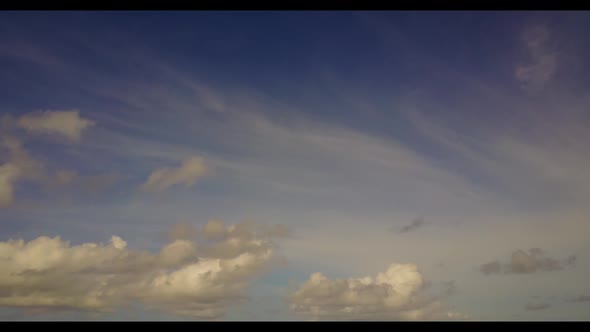 Aerial sky of tranquil coast beach trip by turquoise ocean with white sand background of a dayout ne