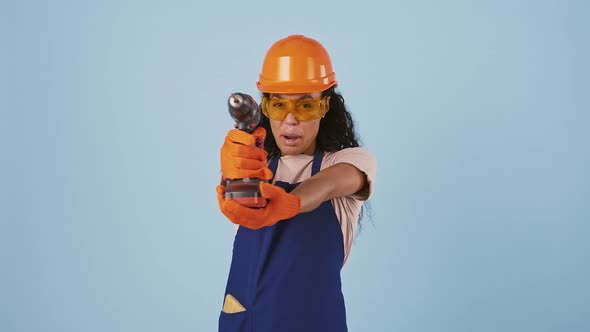 Afroamerican Female Worker in Hard Hat Protective Goggles and Gloves