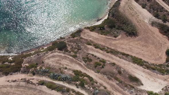 Aerial drone video from eastern Malta, Marsaxlokk area, Il-Hofra l-Kbira bay.