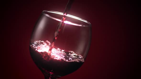 Red Wine Poured into Wine Glass