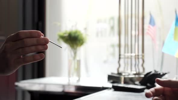 Male Administrator Giving Tourist Business Man Key Card at Hotel Desk