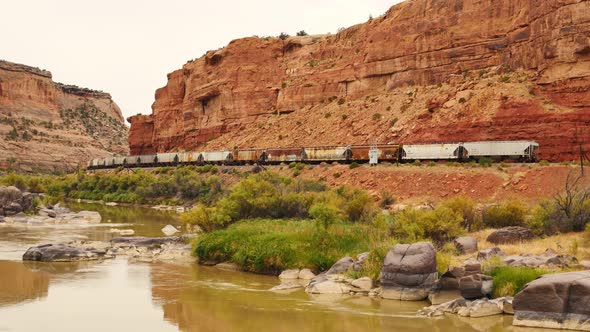 Freight train passes through and disappears in Black Canyon