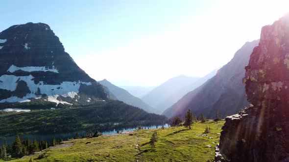 view from logan pass of mountains at glacier national park, visit montana